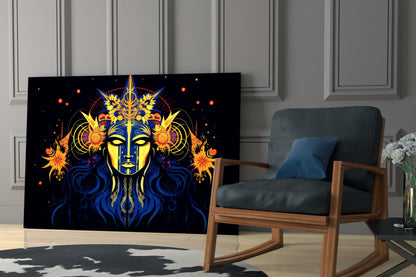 Black glass wall art featuring a mystical blue and gold face with yellow eyes, ornate headdress, and orange celestial elements, displayed in a modern living room beside a wooden chair.