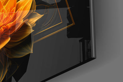 Close-up angled view of gold-framed glass wall art featuring vibrant orange and yellow lotus flower petals against dark background.