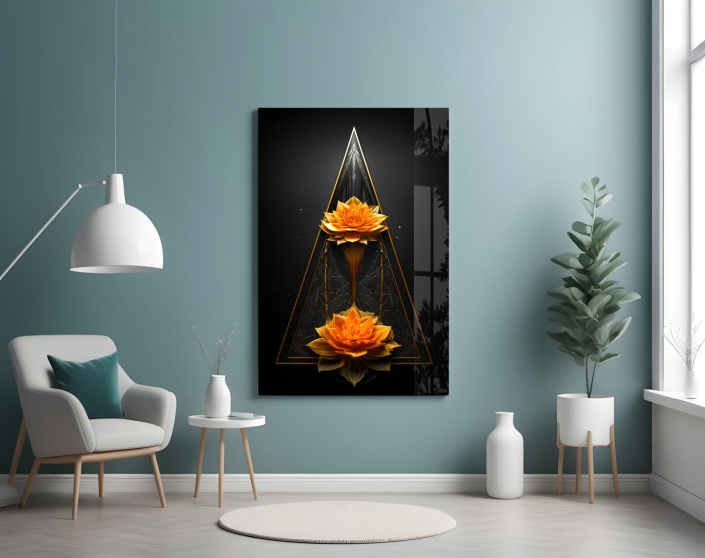 Modern room interior with framed glass wall art depicting two golden lotus flowers in geometric triangular design on turquoise wall.