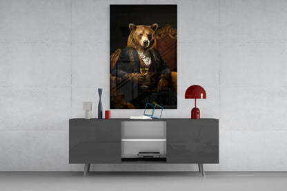 Styled room display of bear portrait glass wall art hung above gray sideboard with red lamp and decorative accessories.