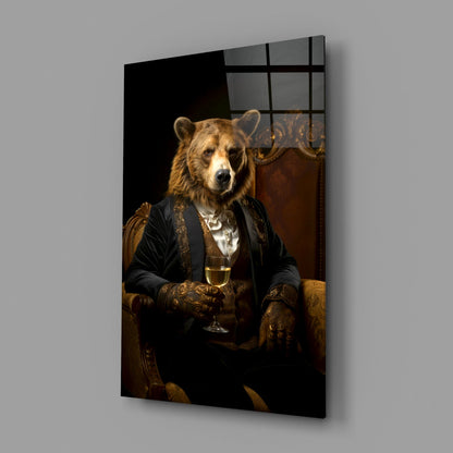 Glass wall art panel displayed at an angle showing a bear in formal attire holding a wine glass against a dark background.
