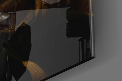 Silhouette of a bear's profile visible through translucent glass panel with gold geometric patterns and black frame detail.