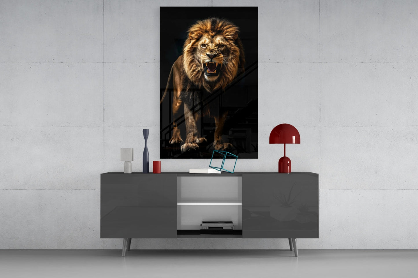 A roaring lion portrait in warm gold tones hangs above a gray media console styled with red decorative accents and accessories.