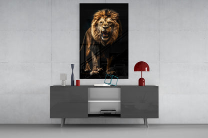 A roaring lion portrait in warm gold tones hangs above a gray media console styled with red decorative accents and accessories.