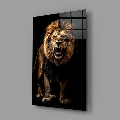 Angled side view of a glass wall art panel displaying a roaring lion with golden mane against black background, mounted on gray wall.
