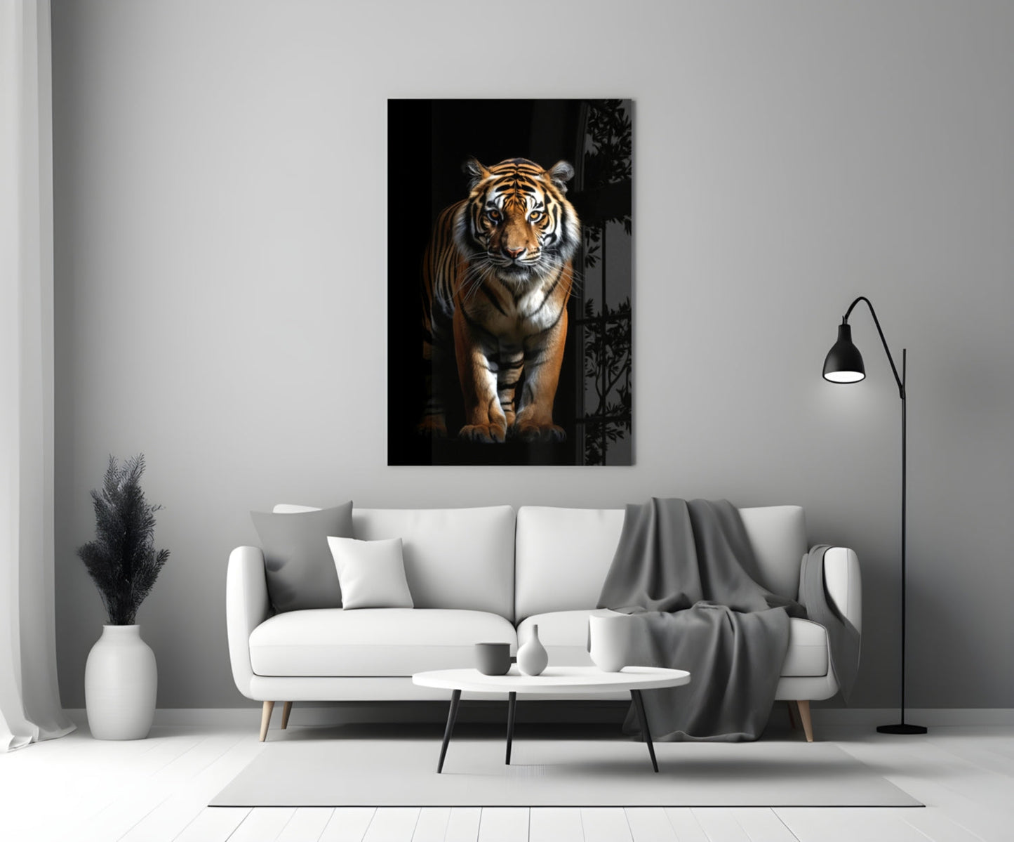 Tiger glass wall art hanging above a white sofa in a minimalist living room setting.