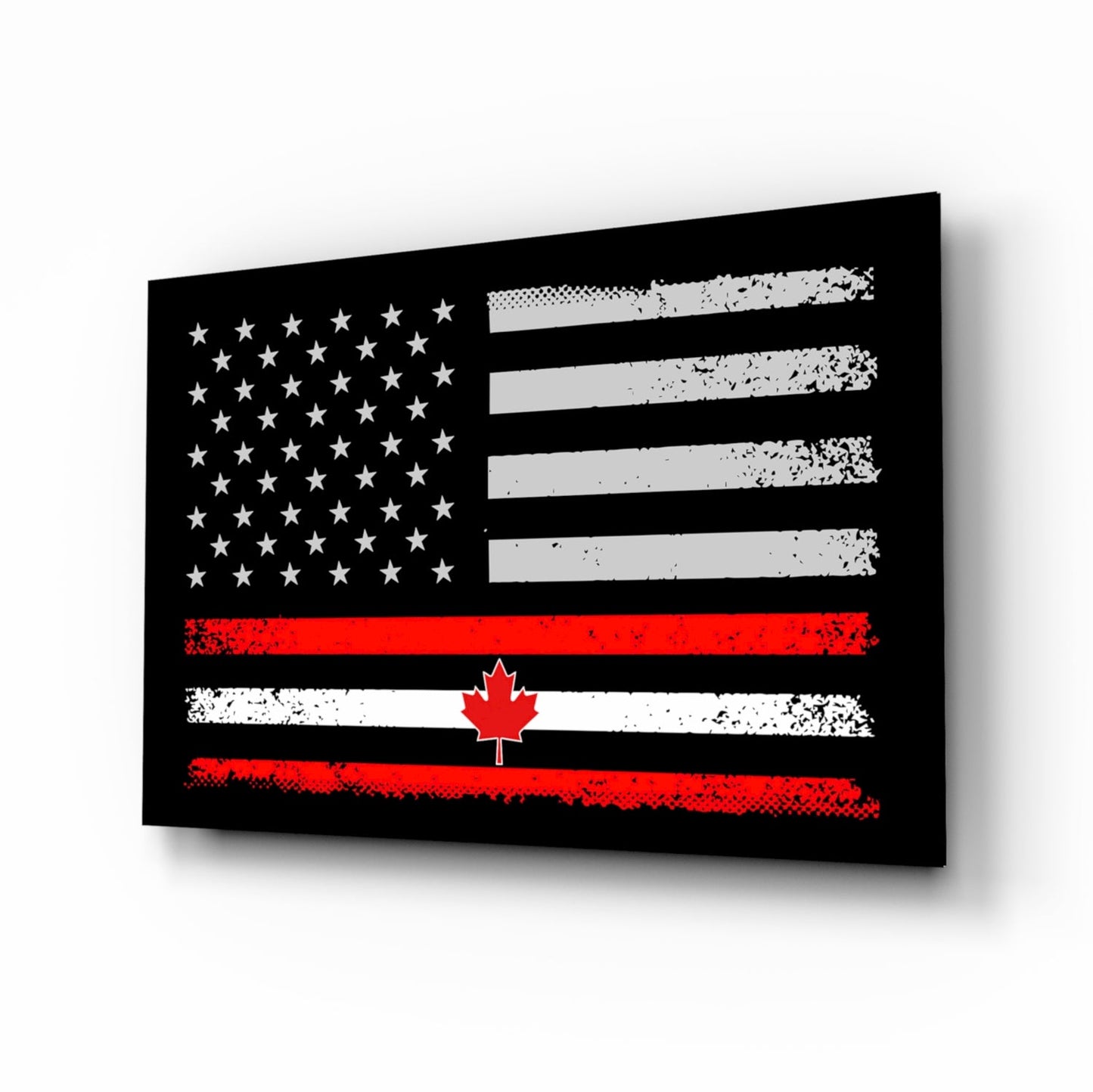 Angled perspective view of black glass wall art featuring a distressed American flag with stars and stripes merged with a Canadian flag displaying a red maple leaf.