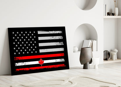 Black glass panel with distressed USA and Canadian flags in white, red, and black displayed on white floor against minimalist interior backdrop.