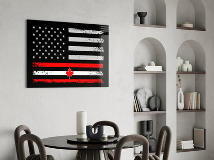 Modern dining room featuring USA-Canada flag glass wall art above black round table with gray chairs and white shelving unit.