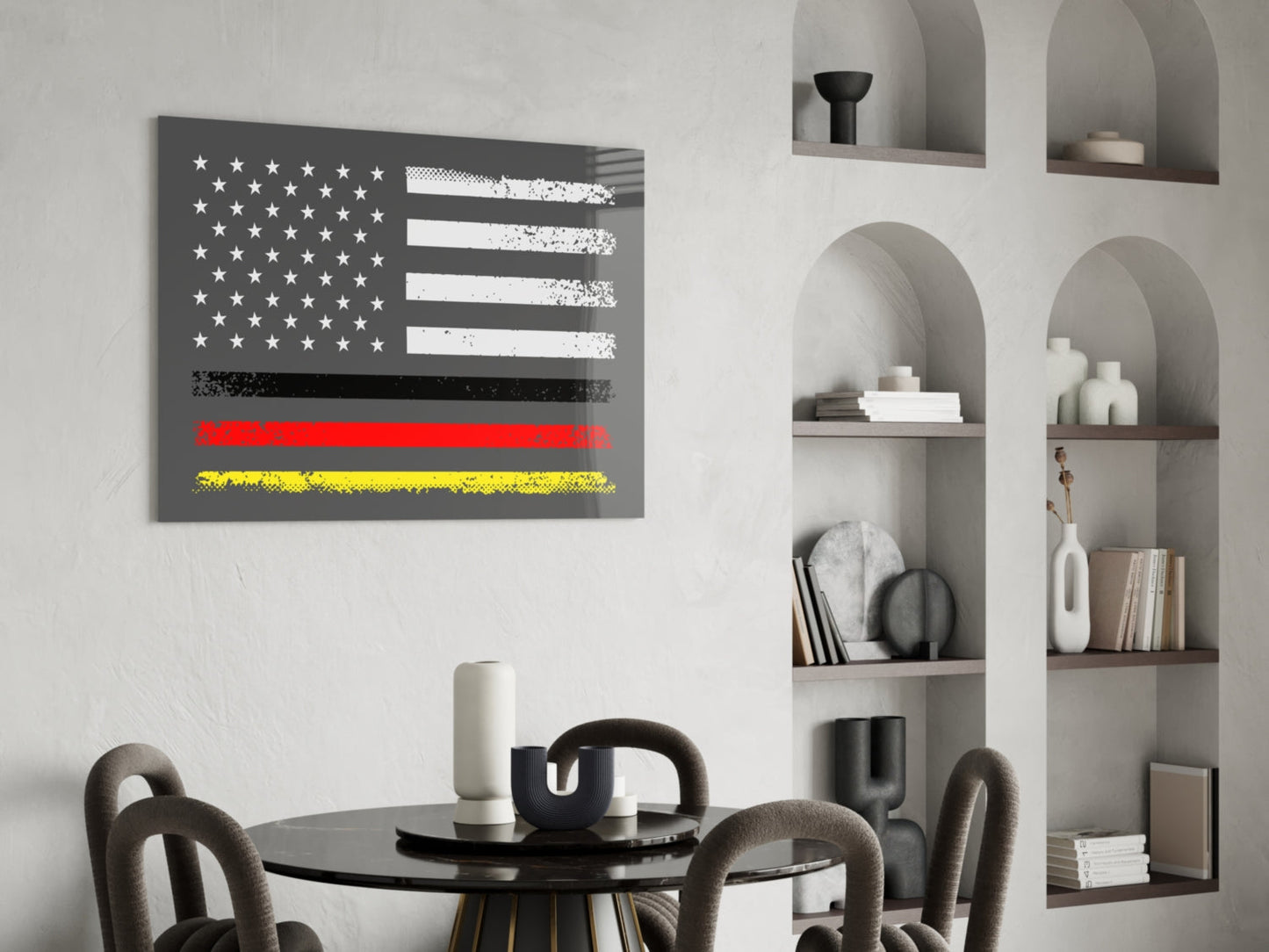 Modern dining room featuring a distressed USA-Germany flag glass wall art above a round black table with gray chairs and white shelving.