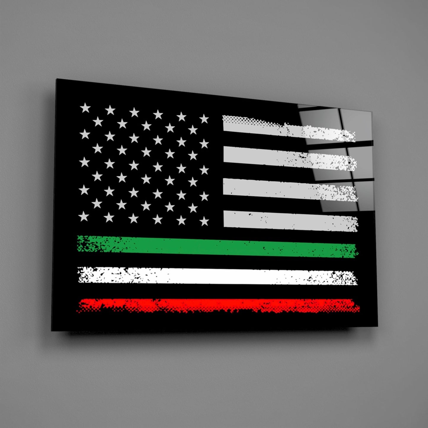 Angled perspective of black glass wall art featuring distressed American flag with green, white, and red horizontal stripes at bottom, mounted on gray wall.