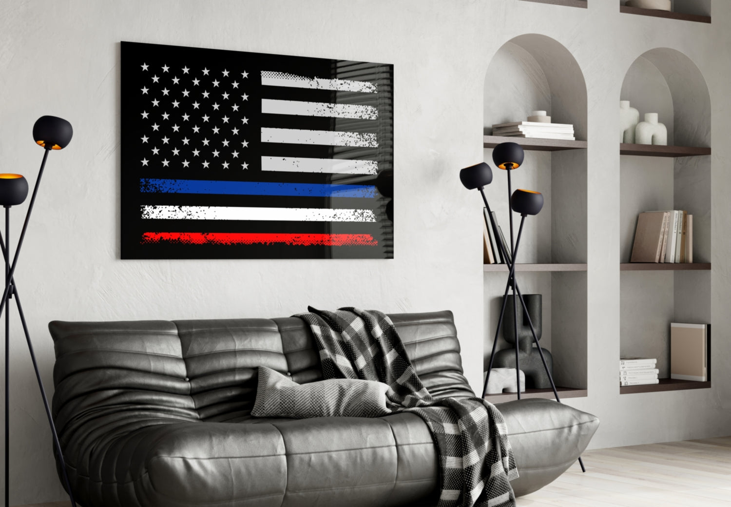 Modern living room with black leather sofa displaying distressed USA-France flag glass wall art featuring blue, white, and red horizontal stripes above.