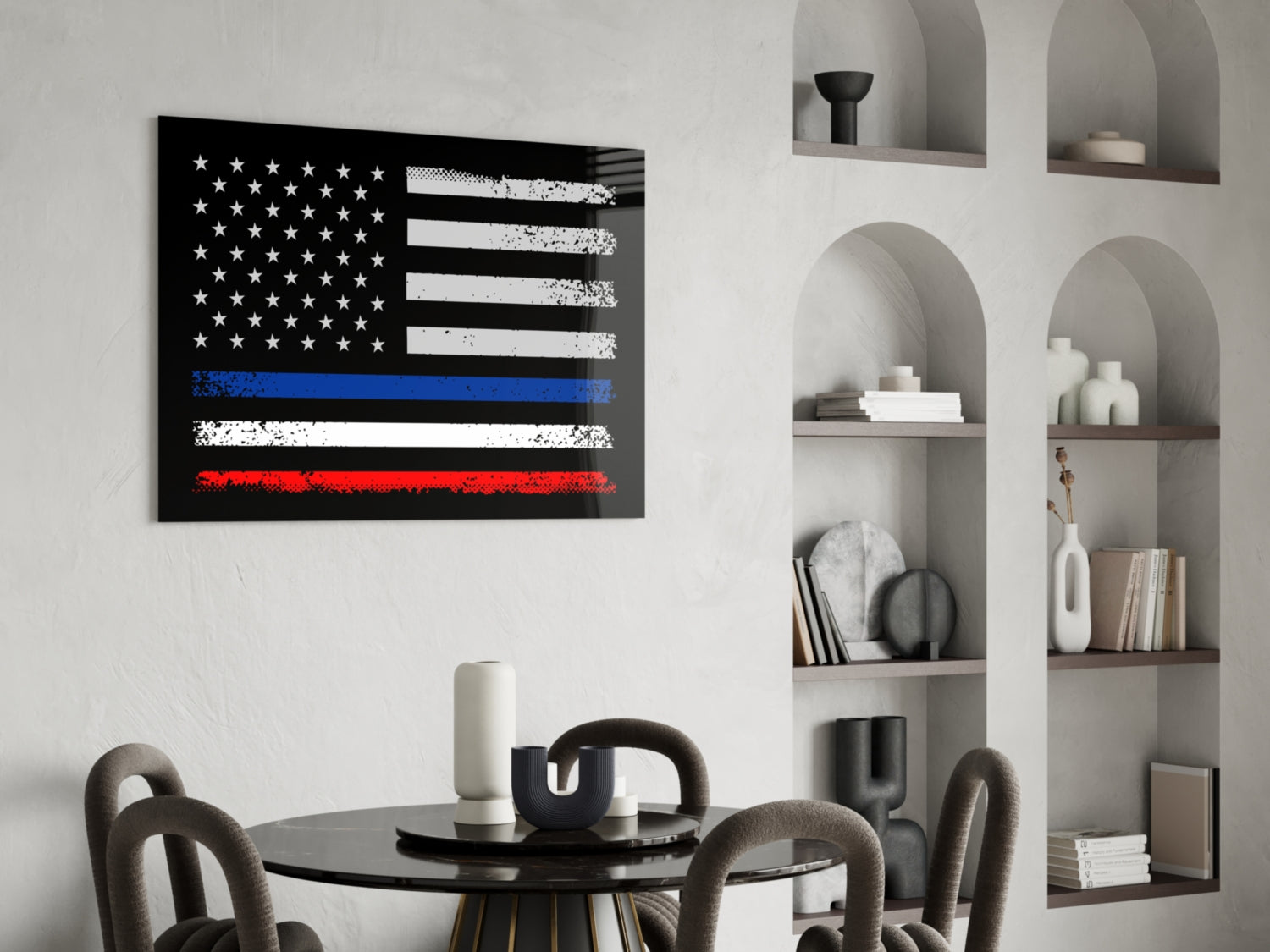 Distressed USA-France flag glass wall art displayed above black round dining table in modern living room with built-in shelving.