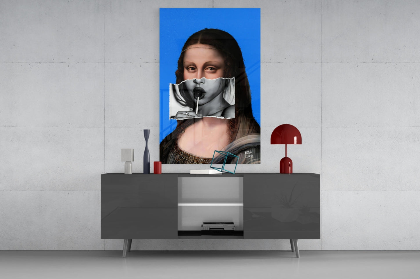 Contemporary Mona Lisa glass wall art with blue background displayed above gray sideboard in modern interior setting.