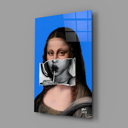 Contemporary glass wall art displaying Mona Lisa with surreal collage effect, blue background, and Windows logo, angled three-quarter view.
