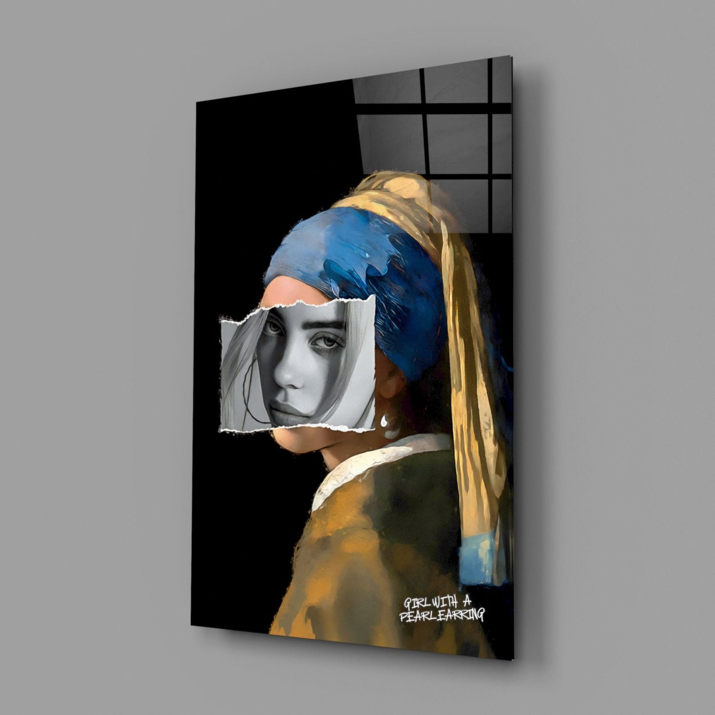 Modern glass wall art displaying a portrait with blue headwrap and pearl earring, featuring monochrome face cutout, mounted on gray wall.