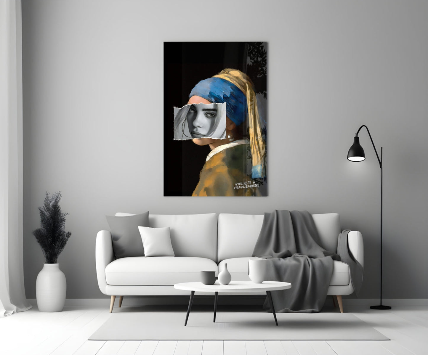 Modern living room interior featuring glass wall art of girl with pearl earring and obscured face, displayed above white sofa.