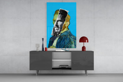 Contemporary portrait glass wall art featuring Van Gogh-inspired imagery with blue background displayed above gray media console.