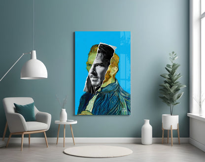 Modern interior room with contemporary portrait glass wall art featuring blue and gold tones displayed above a white armchair.