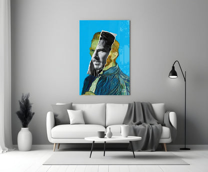 Modern living room with white sofa displaying blue glass portrait art featuring black and white face with golden hair elements above.