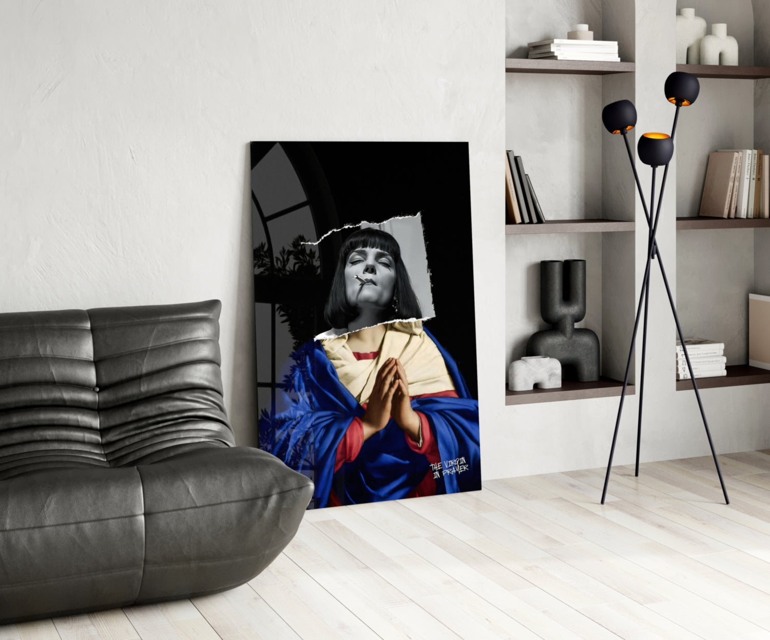 Modern living room with contemporary glass wall art featuring a black and white portrait of a woman wearing blue and red robes.