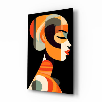 Glass wall art featuring an abstract geometric profile of a woman in orange, cream, and dark tones against black background, displayed at an angle.