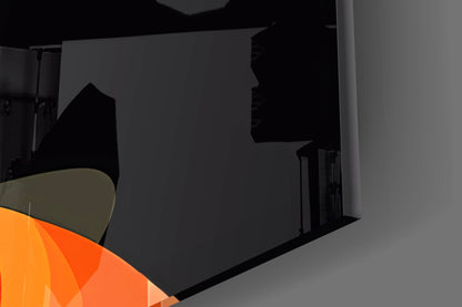 Black glass wall art panel displayed at an angle, showing orange and olive gradient colors in corner.