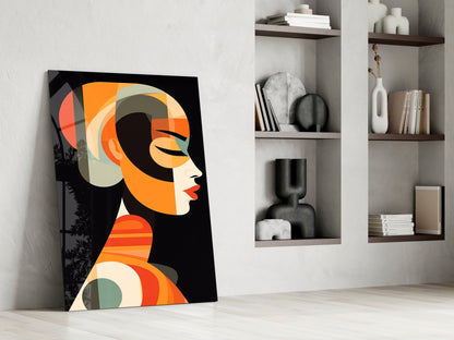 Modern abstract art print leaning against white wall beside built-in shelving with decorative objects and books.