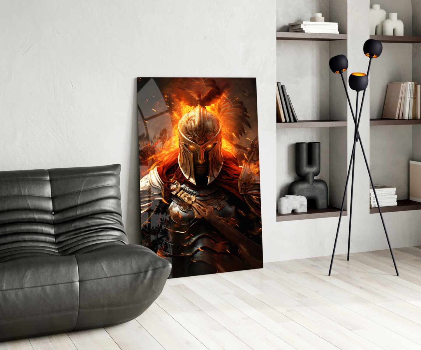 Warrior Glass Wall Art leaning against white wall in modern living room with gray leather chair and shelving unit.