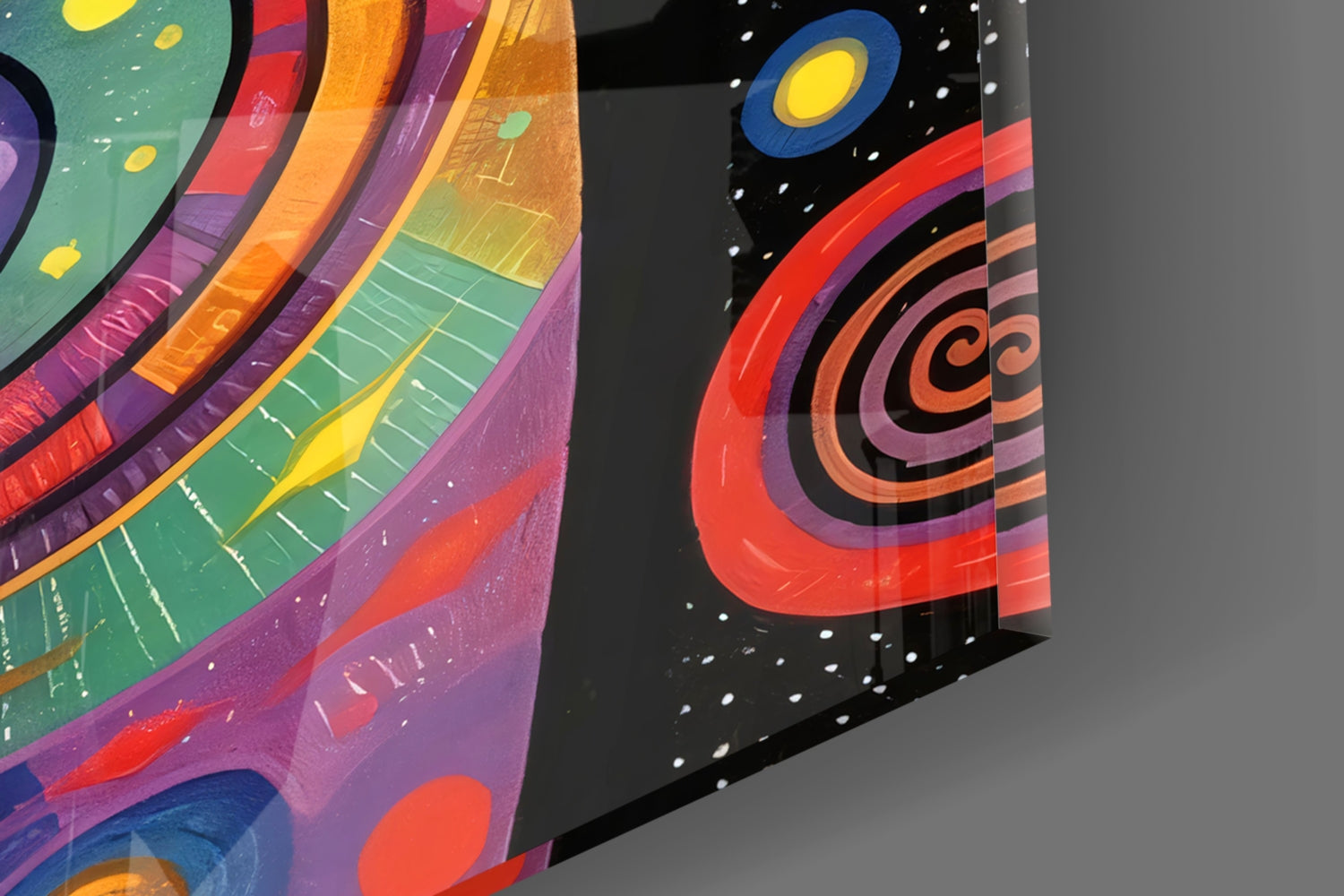 Two angled glass panels displaying colorful concentric circles and celestial designs in red, orange, purple, and teal against black backgrounds with white stars.