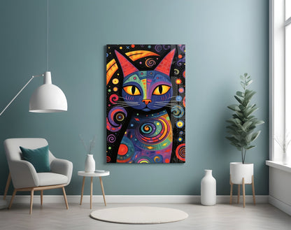 Colorful abstract cat artwork with red ears and yellow eyes displayed on teal wall above white chair in modern room setting.