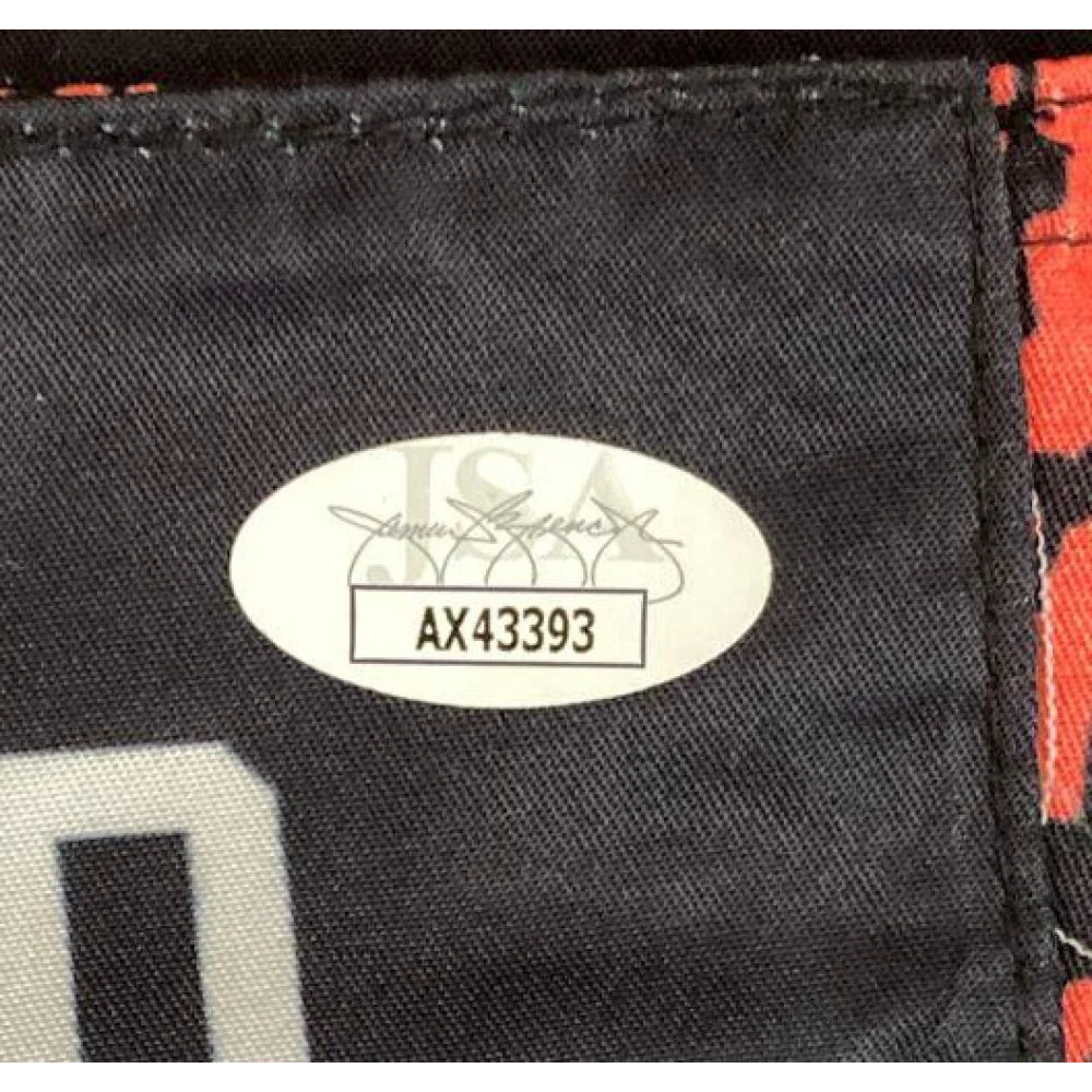 Authentication sticker on black MMA trunks signed by Dustin Poirier with JSA cert