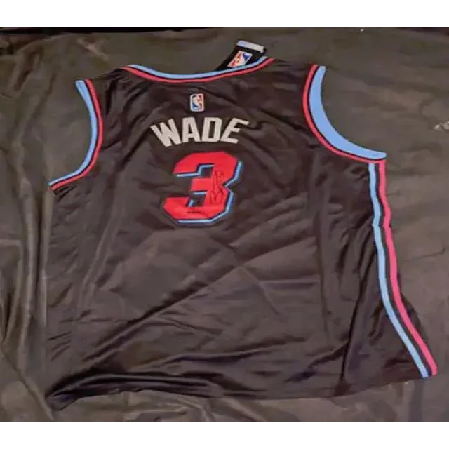 Black Dwayne Wade autographed jersey with blue red trim and Wade autographed jersey logo