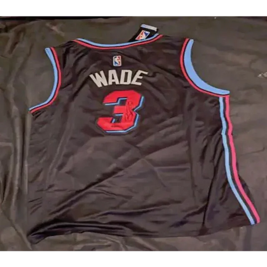 Black Dwayne Wade autographed jersey with blue red trim and Wade autographed jersey logo