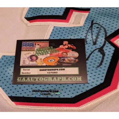 Dwyane Wade autographed Miami Heat jersey with authentication sticker, light blue with black and pink trim