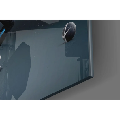 Sleek black silver circular wall clock on dynamic sports splash glass wall art