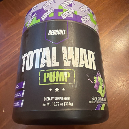 REDCON1 Total War Pump black container with purple and green accents displayed on wooden surface, front label visible.