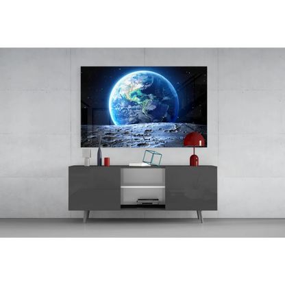 Sleek gray media console with minimalist legs below glass wall art print