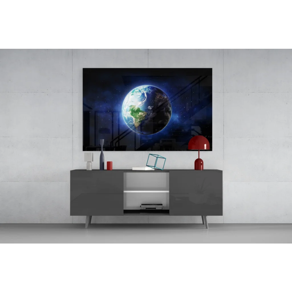 Sleek gray console table with open shelving under Earth from space wall art