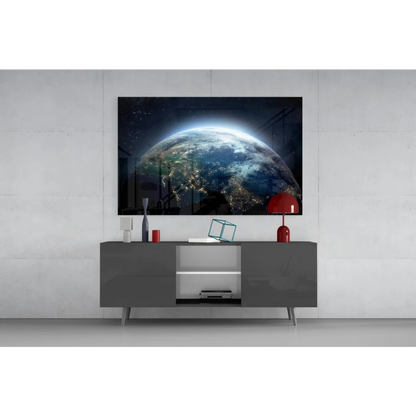 Sleek gray console table with minimalist legs under Earth From Space glowing cities wall art canvas print