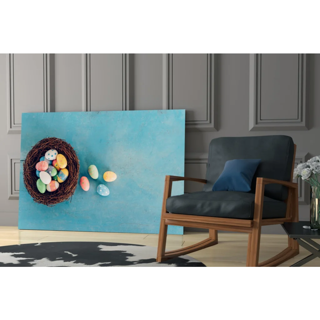 Vibrant glass wall art of blue canvas with woven nest and colorful Easter eggs