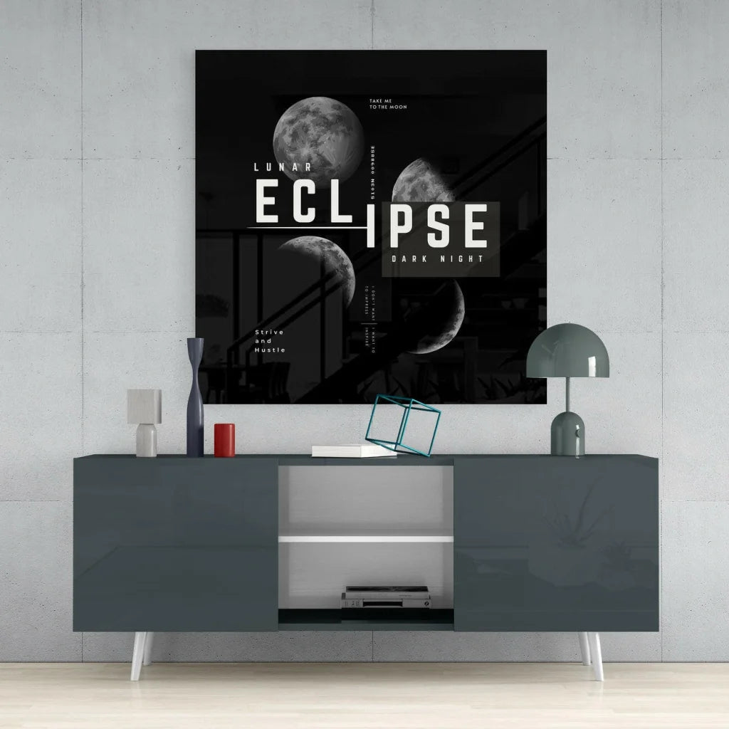 Black and white lunar eclipse glass wall art with bold moon phases