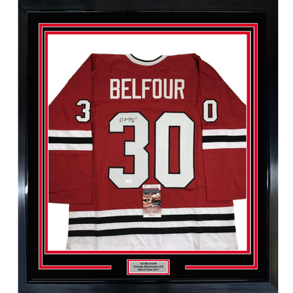 Framed red Chicago Blackhawks jersey number 30 with "BELFOUR" nameplate, signed, displayed front-facing with JSA authentication certificate visible.