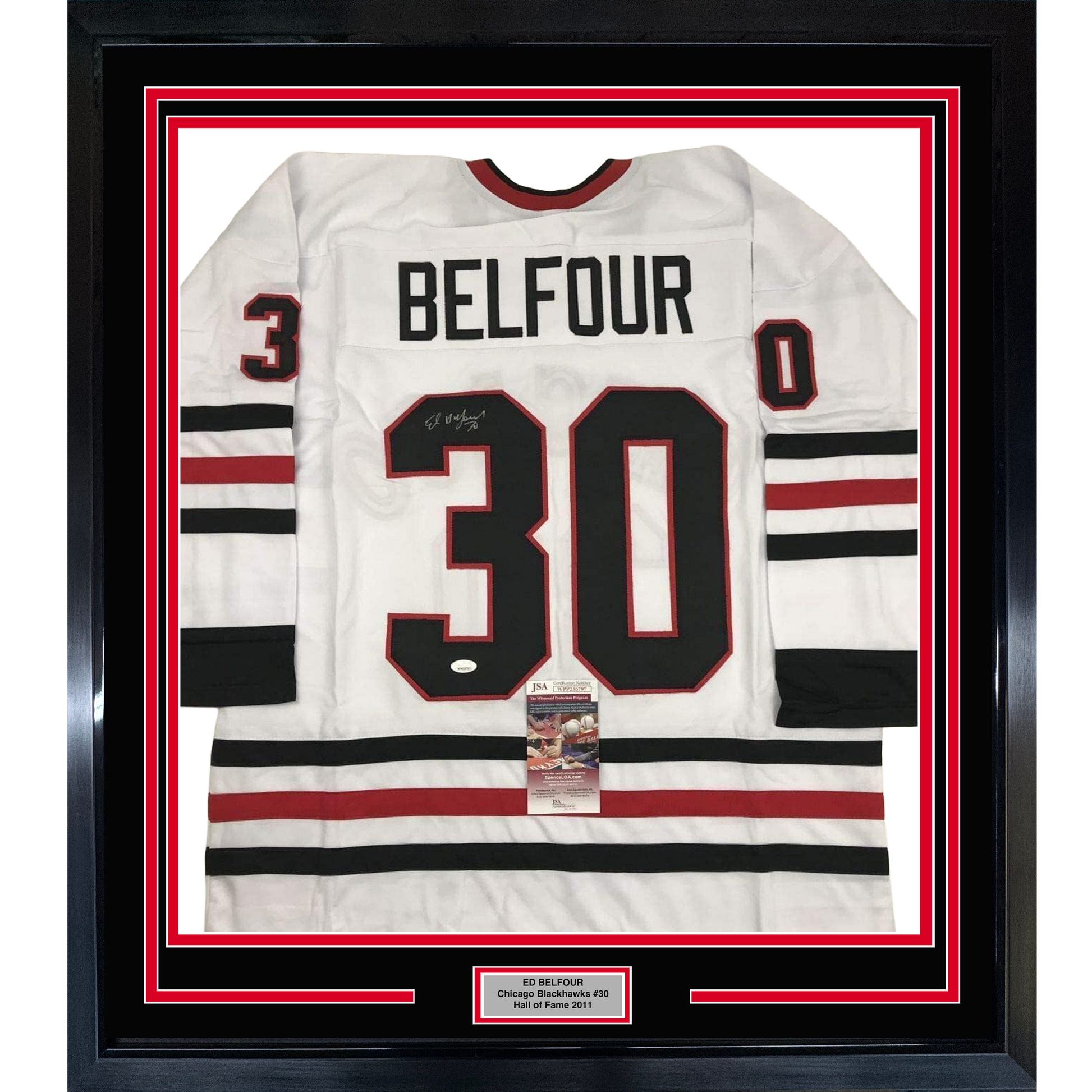 Framed white Chicago Blackhawks jersey number 30 with "BELFOUR" nameplate, red and black stripes, displayed against red and black matting with JSA authentication certificate visible.