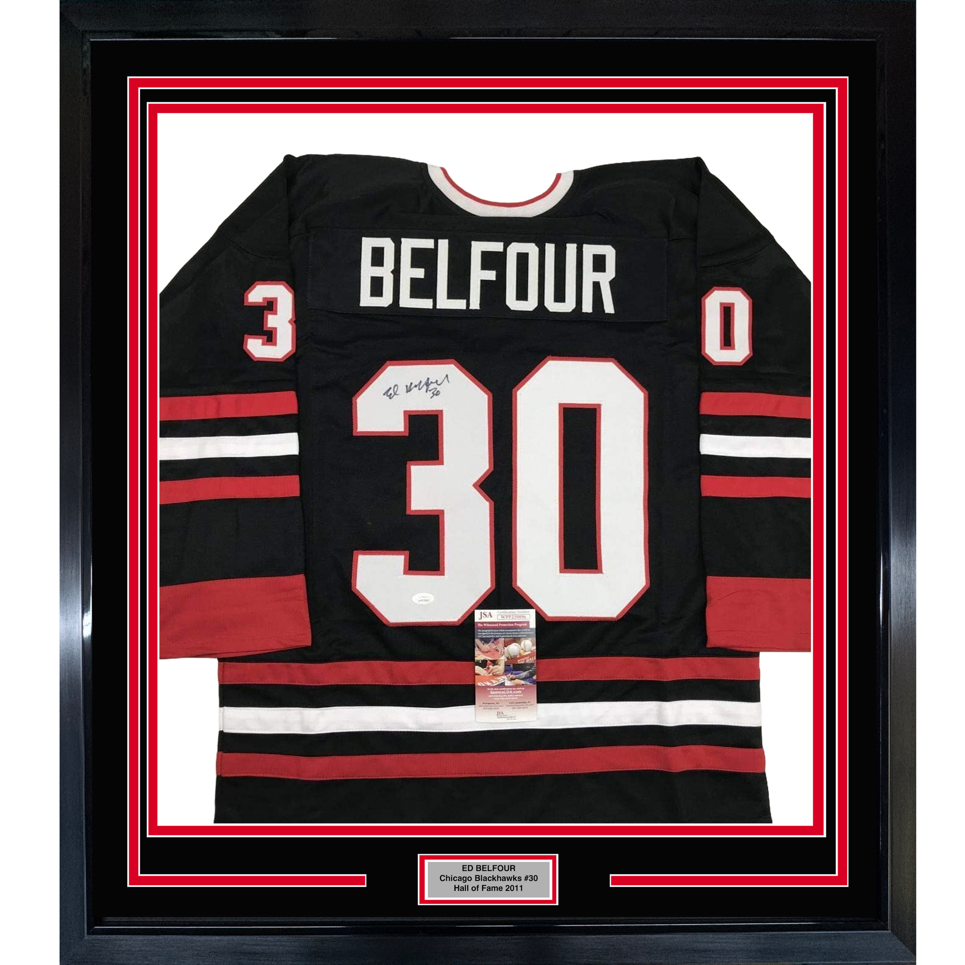 Framed black Chicago Blackhawks hockey jersey #30 with "BELFOUR" nameplate, signed, displayed front-facing with red and white stripes and JSA authentication certificate visible.