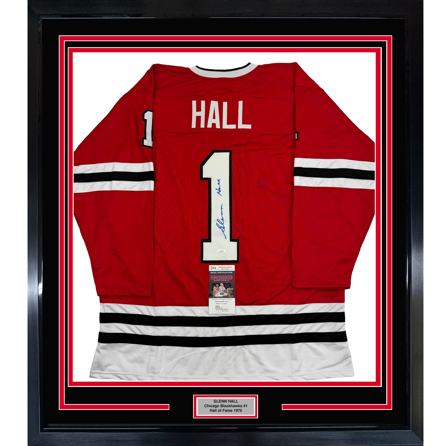 Framed red Chicago Blackhawks #1 hockey jersey with "HALL" nameplate and signature, displayed front-center against white backing with red and black border frame.