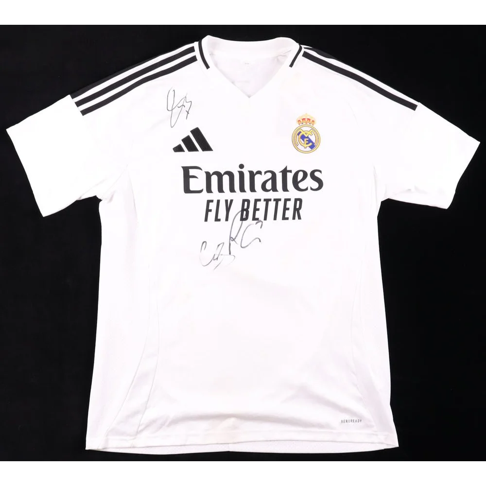 White Real Madrid jersey signed by Eder Militao with two autographs and black shoulder stripes