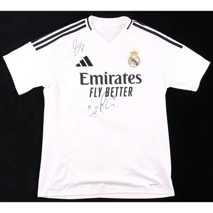 White Real Madrid jersey signed by Eder Militao with two autographs and black shoulder stripes