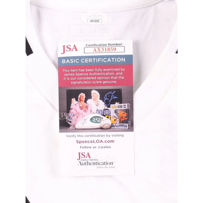 White Real Madrid jersey with authentication tag signed by Eder Militao