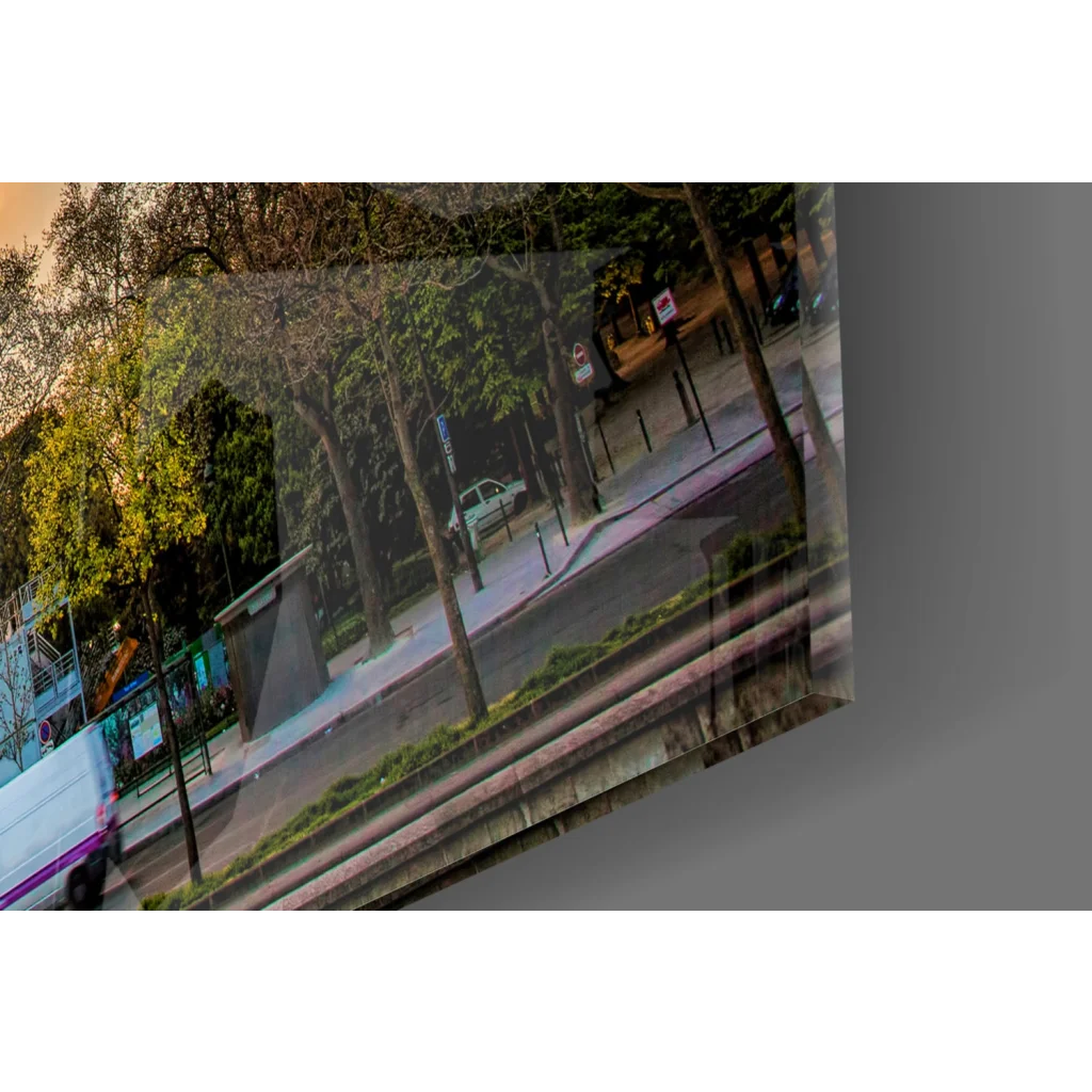Tilted Eiffel Tower sunset glass wall art with urban trees and vehicles